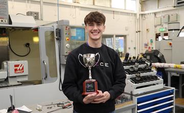 UK ATC apprentice Luca Milan pictured with his award in the workshop.