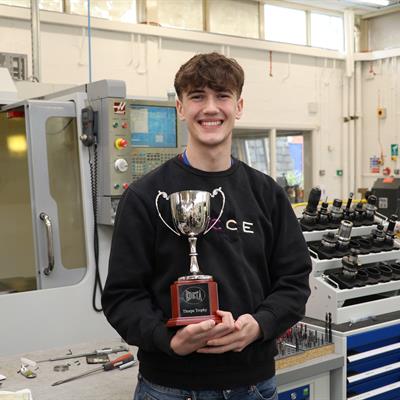 UK ATC apprentice Luca Milan pictured with his award in the workshop.