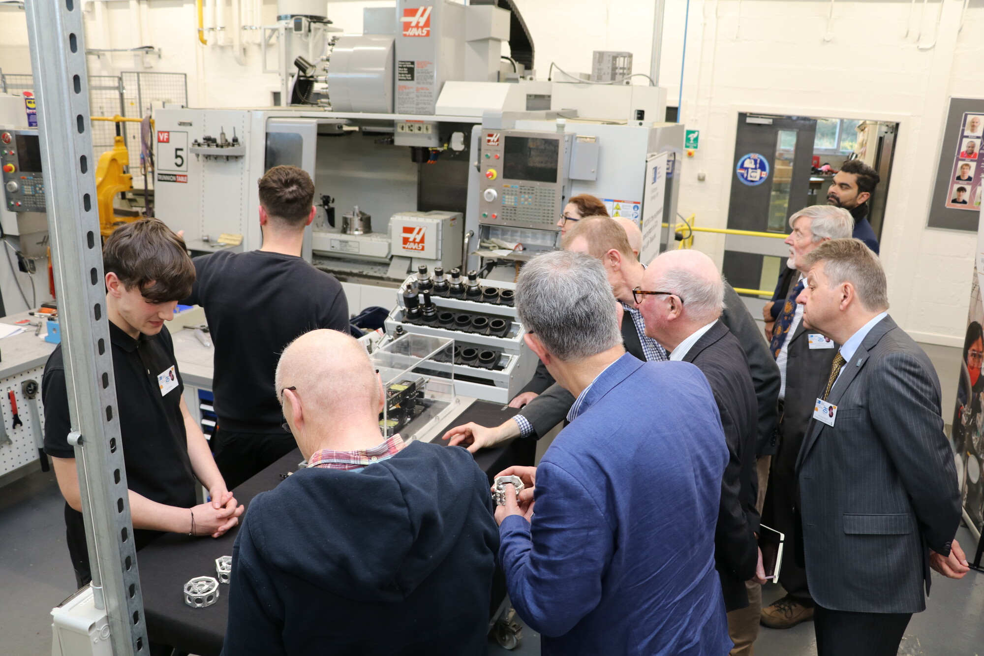 Visitors on a tour of the workshop are shown various components made on site at UK ATC.